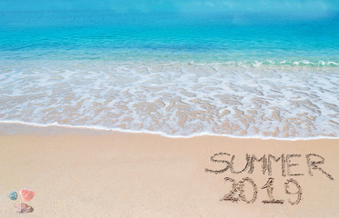 Summer 2019 written on the sand