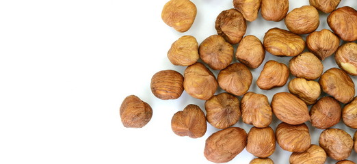 Heap of hazelnuts isolated on white background