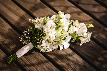 wedding bouquet on wooden table, rustic bouquet for bride.
