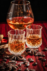 Brandy or liquor,Set of strong alcoholic drinks in glasses and shot glass on dark wood background