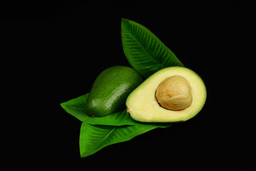 green avocado fruit with half  