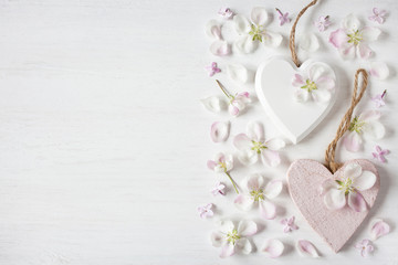 Light background with hearts, flowers of apple and lilac