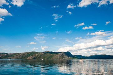 trip to nordkapp, view to a fjord with a boat