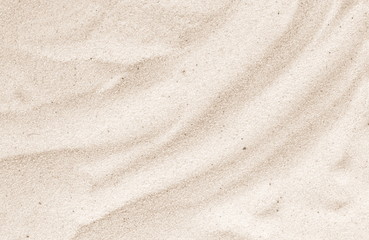 Fototapeta na wymiar Sand on the beach as background. Sand Texture. Brown sand. Background from fine sand.