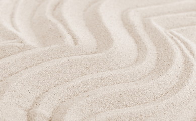 Fototapeta na wymiar Sand on the beach as background. Sand Texture. Brown sand. Background from fine sand.