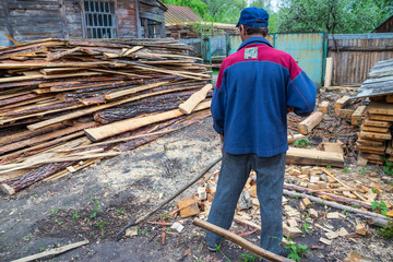 Worker cleans the area of forestry production