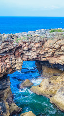 View of a hole in a rock called the mouth of hell or Boca do Inferno in Cascais in Portugal