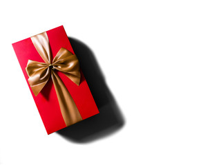 Concept or idea of flat view of red gift box with gold ribbon or bow.