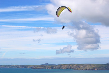 Paraglider flying above Newgale Bay