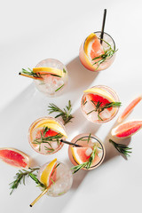Naklejka premium Grapefruit and Rosemary cocktail. Refreshing and non-alcoholic drink perfect for spring or summer.