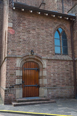 Plakat wooden door of church Sint Dominicuskerk Tiel, The Netherlands