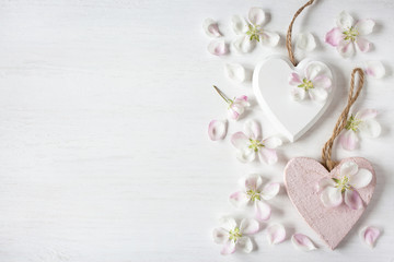 Light background with hearts and flowers of apple