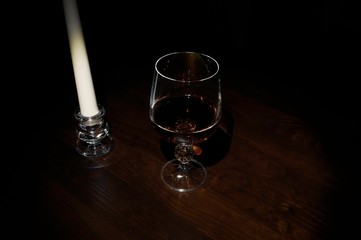 Glasses and candle on the table