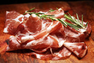 Italian sliced cured coppa with spices. Raw ham. Crudo or jamon cured cold meat