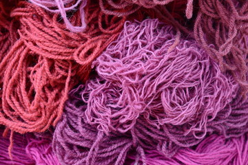 Color yarn for knitting, knitting wool balls . Beautiful yarn knitting background. Close up of multi colored kitting yarn.