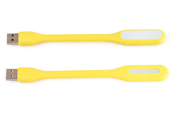 USB yellow plastic LED light lamp, isolated on a white background. Closeup.
