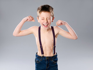 Thin boy showing muscles © Pavel Jonas