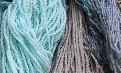 Color yarn for knitting, knitting wool balls . Beautiful yarn knitting background. Close up of multi colored kitting yarn.
