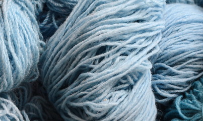 Color yarn for knitting, knitting wool balls . Beautiful yarn knitting background. Close up of multi colored kitting yarn.