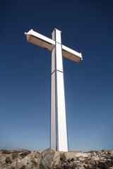 large white cross against a blue sky
