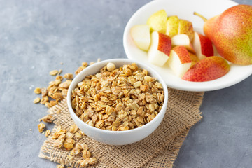 Healthy breakfast with muesli and pear.