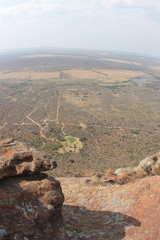 road in the mountains with African continent shape land