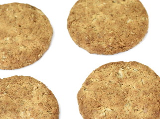 Round whole wheat biscuit, cookie with raisins isolated on white background. Biscuits with whole-wheat (wholemeal) flour isolated on white background 