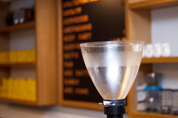 coffee machine grinding coffee interior of the coffee shop