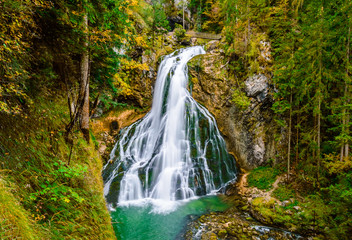 Gollinger Waterfall in Golling an der Salzach near Salzburg, Austria. Stunning view of cascade waterfall over mossy rocks in the Alps with long exposure © Julia Lavrinenko