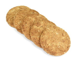 Round whole wheat biscuit, cookie with raisins isolated on white background. Biscuits with whole-wheat (wholemeal) flour isolated on white background 