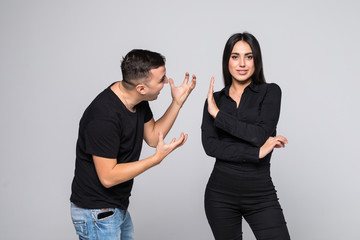 Angry couple shouting at each other on white background. Man quarrel with her woman isolated on white background