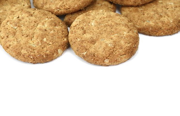 Round whole wheat biscuit, cookie with raisins isolated on white background. Biscuits with whole-wheat (wholemeal) flour isolated on white background 