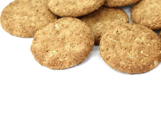 Round whole wheat biscuit, cookie with raisins isolated on white background. Biscuits with whole-wheat (wholemeal) flour isolated on white background 
