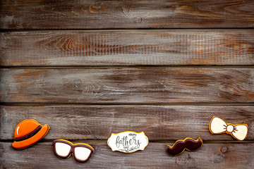hat, moustache, glasses, bow tie and copy for Happy Father Day party on wooden background top view copy space