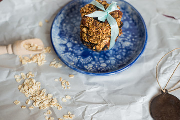 asty homemadeoats cookies decorated of blue satin ribbon on the creative bright blue plate