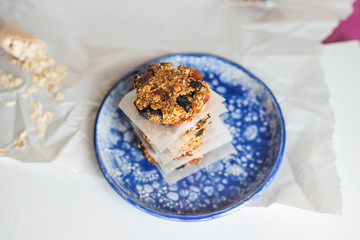 asty homemadeoats cookies decorated of blue satin ribbon on the creative bright blue plate