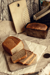 fresh homemade sourdough wheat form bread  served on the rustic background