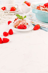 Traditional Italian cake with mascarpone cheese and berries. Tiramisu with raspberry berries and espresso coffee. Homemade breakfast. Copy space.
