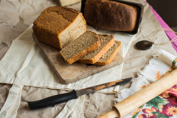 fresh homemade sourdough wheat form bread  served on the rustic background