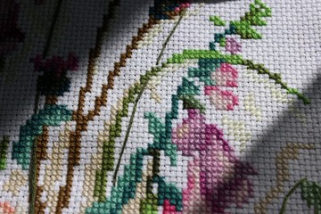 cross-stich embroidery in process under sunlight