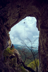 Rappeling in a cave.