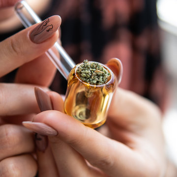 glass smoking tube for smoking marijuana buds. Female health & cannabis