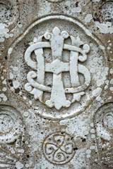 Monogram representing the first three letters for 'Jesus' in the Greek alphabet on a Celtic cross