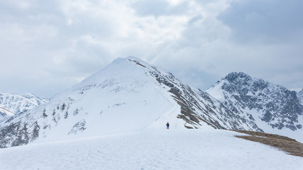Fototapeta na wymiar Silhouette of a man on a background of mountains