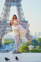 Happy romantic couple in Paris, near the Eiffel tower