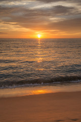 Obraz premium Beautiful sunset in the pacific ocean, at Punta Lobos Beach, Todos Santos, Baja California Sur, Mexico