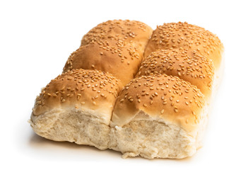 Group of sesame seeded hamburger buns isolated on a white