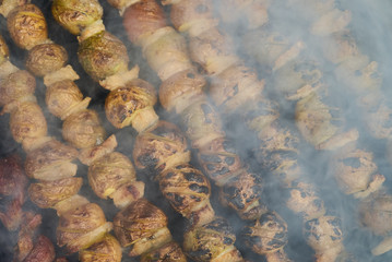 Grilled shish kebab with vegetables. BBQ grill with lamb meat and potatoes