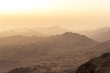 Middle East or Africa, picturesque bare mountain range and a large sandy valley desert landscapes landscape photography