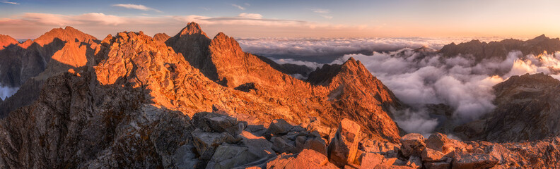 Fototapeta na wymiar Mountains Landscape with Inversion in the Valley at Sunset as seen From Rysy Peak in High Tatras, Slovakia